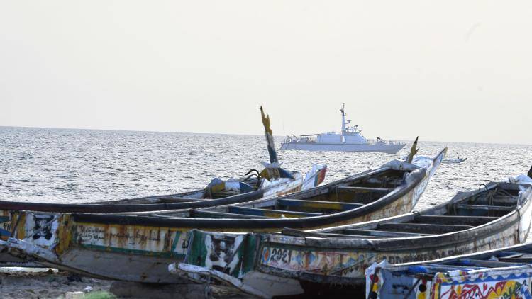 A Senegalese army boat anchors in the background to ensure the safety of the installation site of a platform where an important offshore gas discovery is being exploited, off the coast of Saint Louis, Senegal, on 10 October 2022.