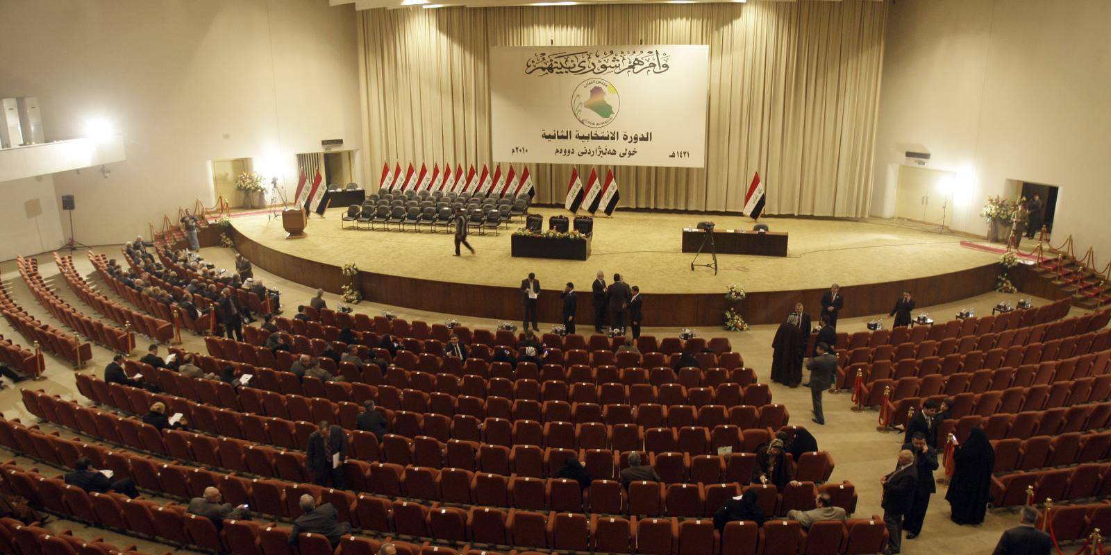 Politicians filing into the Iraqi parliament