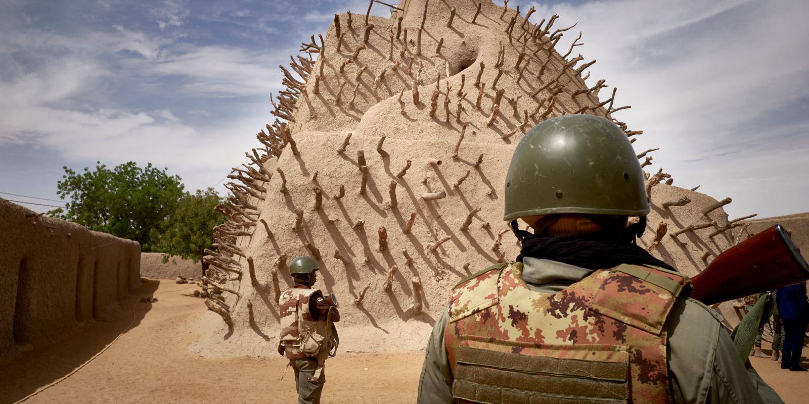 Soldiers patrol the site of the Tomb of Askia in Gao, Mali