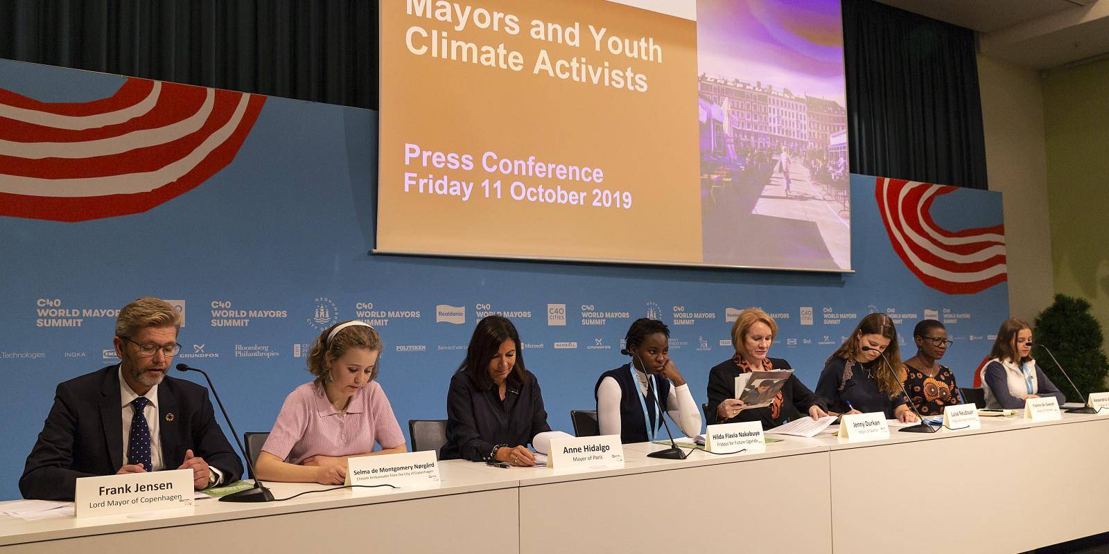 Photo of mayors and youth activists hold a joint press conference at the C40 World Mayors Summit on 11 October 2019 in Copenhagen, Denmark.