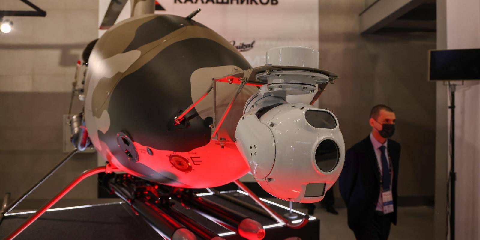 Photo shows an armed drone on a plinth in an exhibition setting