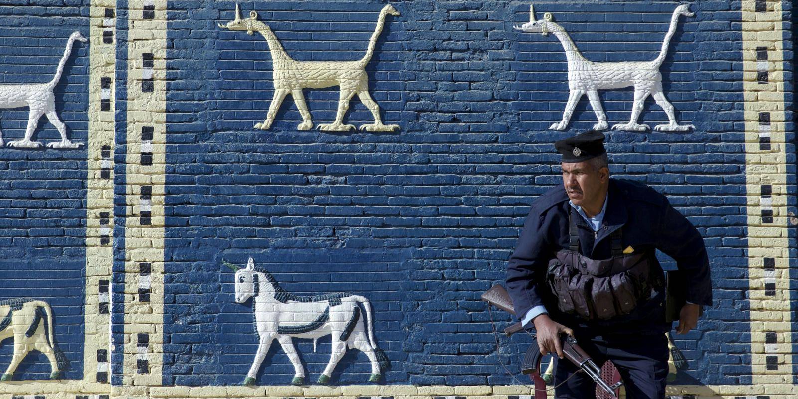 A guard in front of a replica of the Ishtar Gate at the ancient city of Babylon, Iraq, on 20 December 2016.