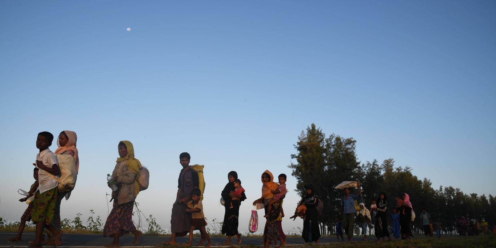 Refugees walk to a camp in Bangladesh.