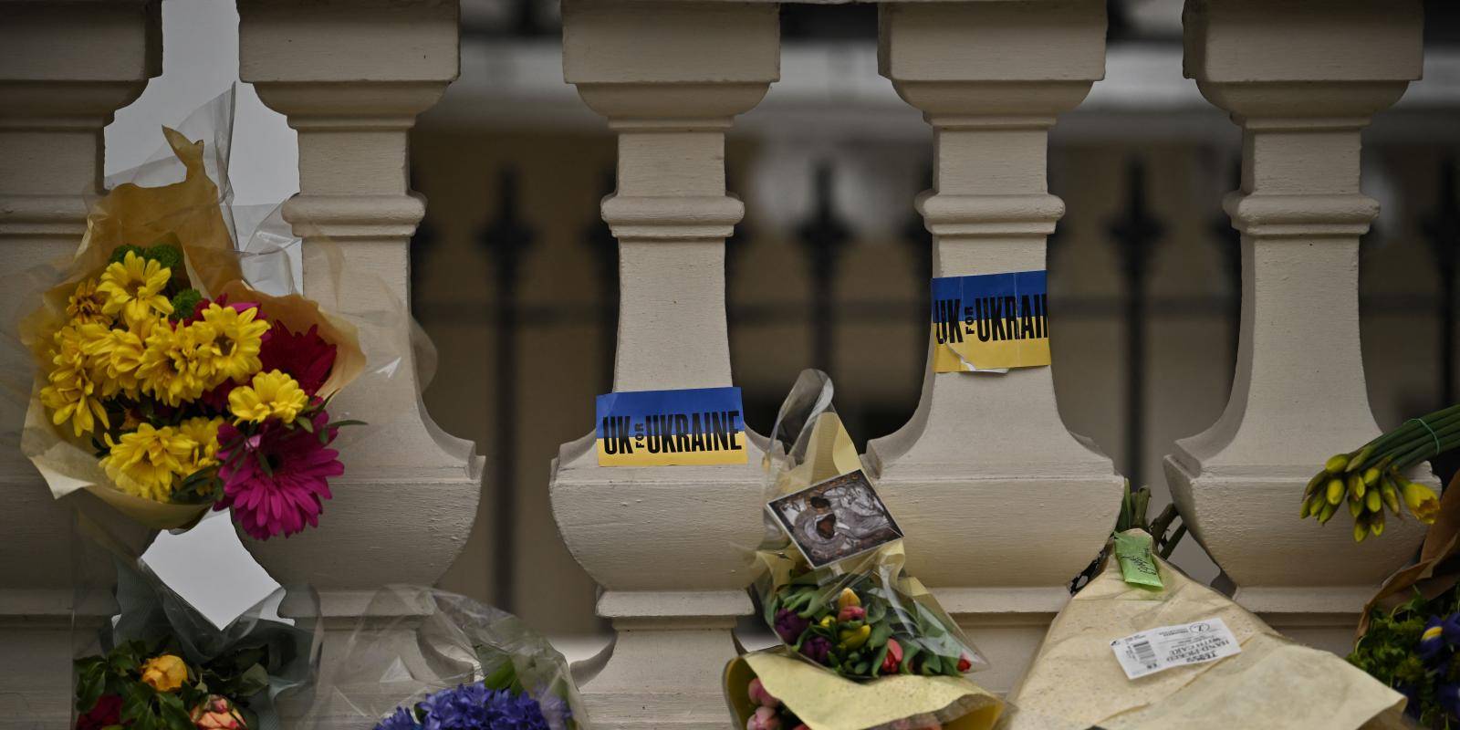 Flowers and messages of support seen outside the Ukrainian embassy in London, UK, on 5 March 2022.