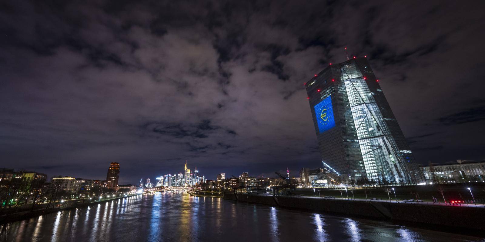 A nighttime photo of the headquarters of the European Central Bank in Frankfurt.