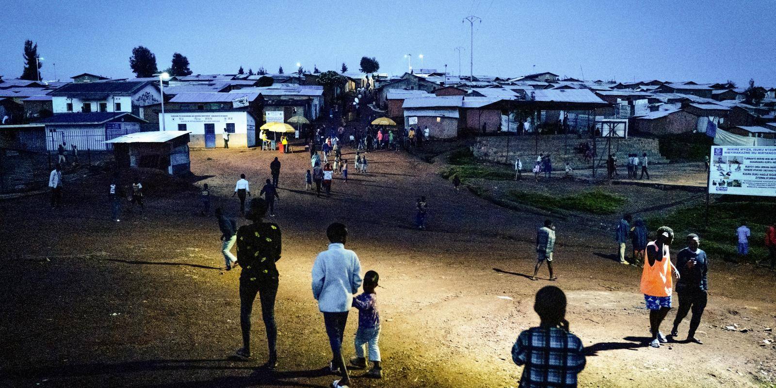 Photo shows market square at Gihembe refugee camp lit up at night