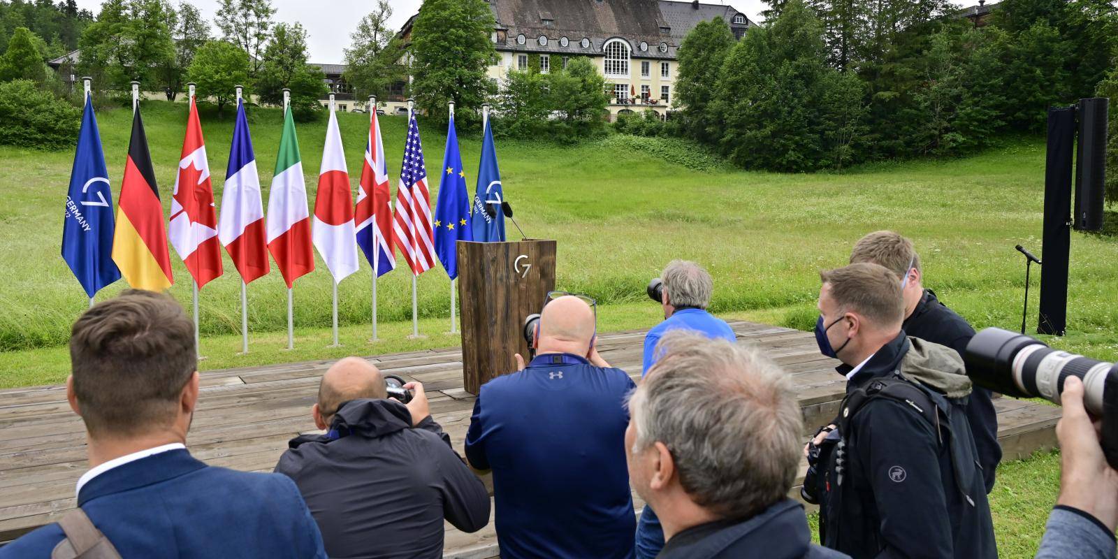 Photographers prepare for the third day of the 2022 G7 summit at Schloss Elmau in Germany.