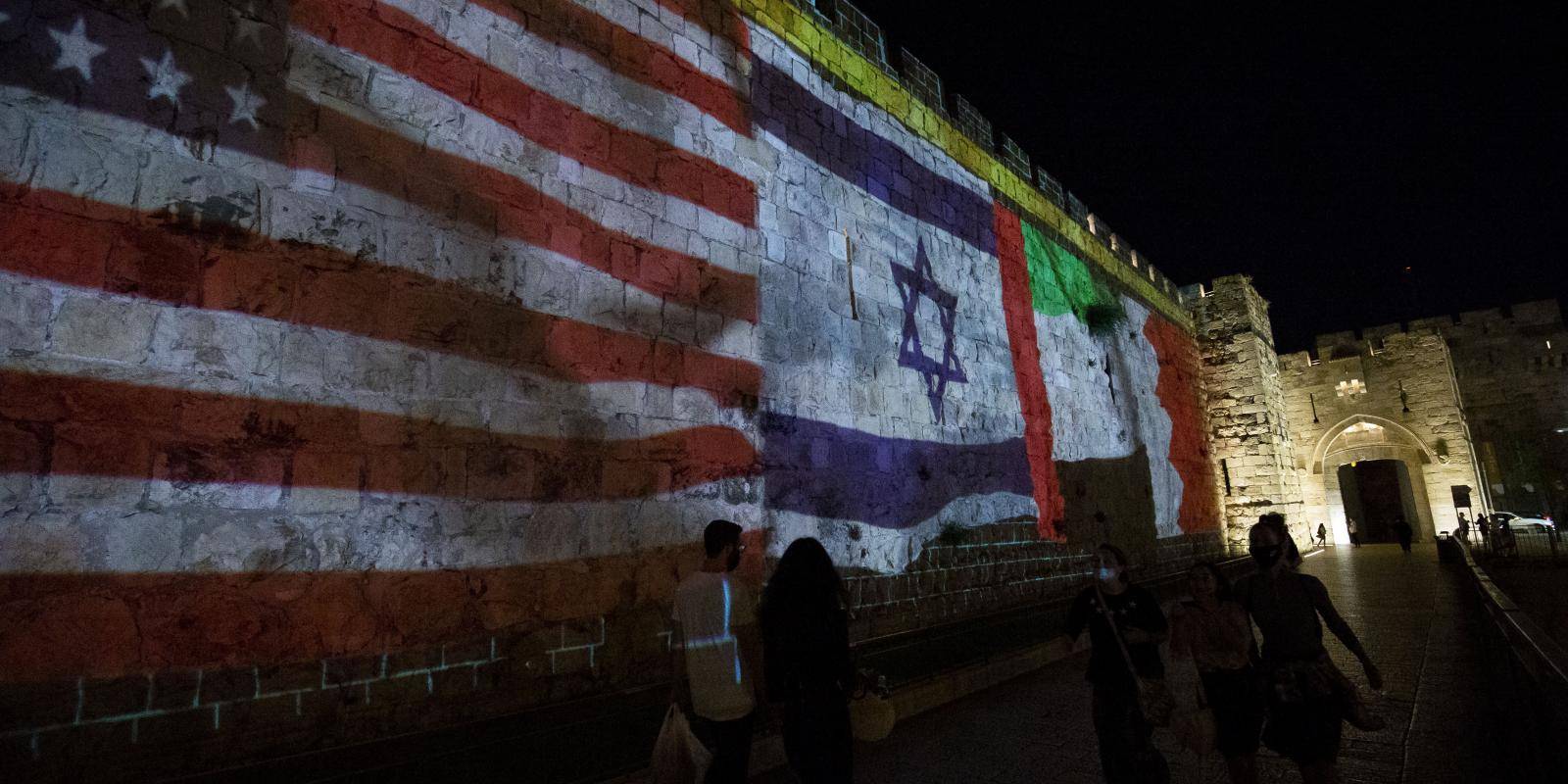 The flags of the US, Israel, the UAE and Bahrain are projected on the walls of Jerusalem's Old City to mark the signing of the Abraham Accords on 15 September 2020.