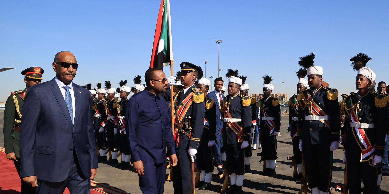 Ethiopian prime minister Abiy Ahmed and Sudanese army chief Abdel Fattah al-Burhan inspect Sudanese military personnel in full dress uniform