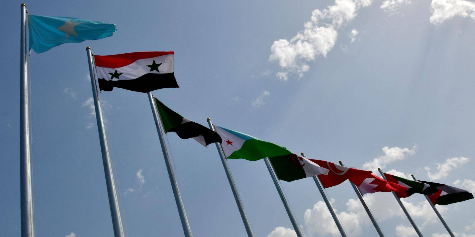 Photo of national flags of the Arab league countries.