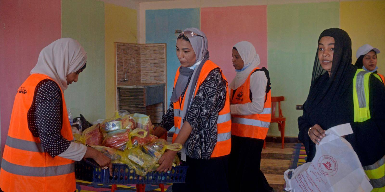 Volunteers prepare aid packages