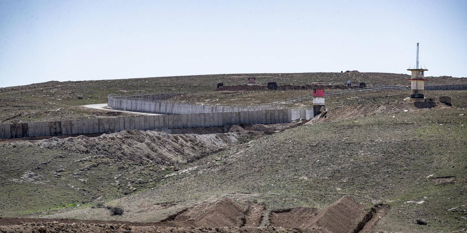 Concrete wall on the border between Iraq and Syria.