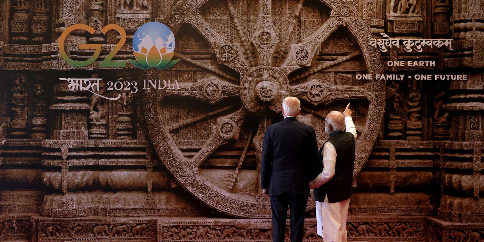 A rear view of US president Joe Biden and Indian prime minister Narendra Modi looking at an image of a temple wheel at the G20 summit in New Delhi