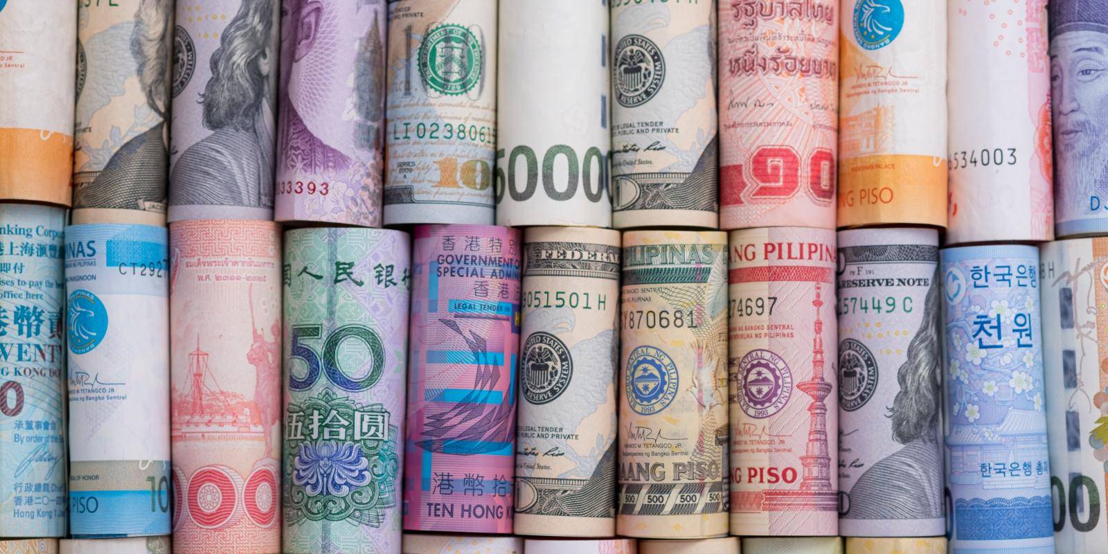 Rolled up multi-currency bank notes