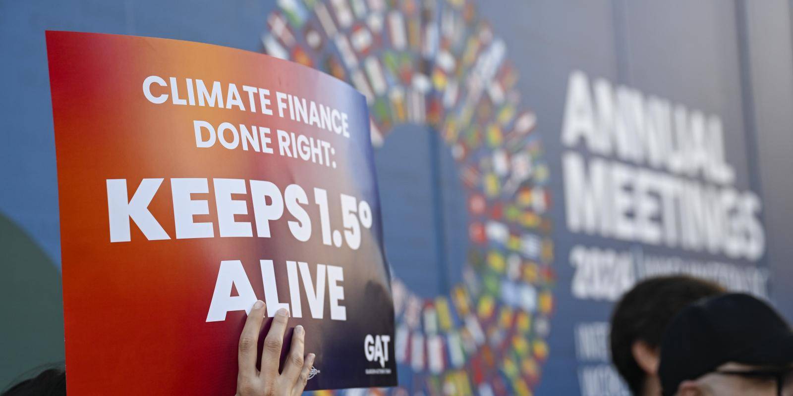 A climate activist protests at the meetings of the IMF and World back