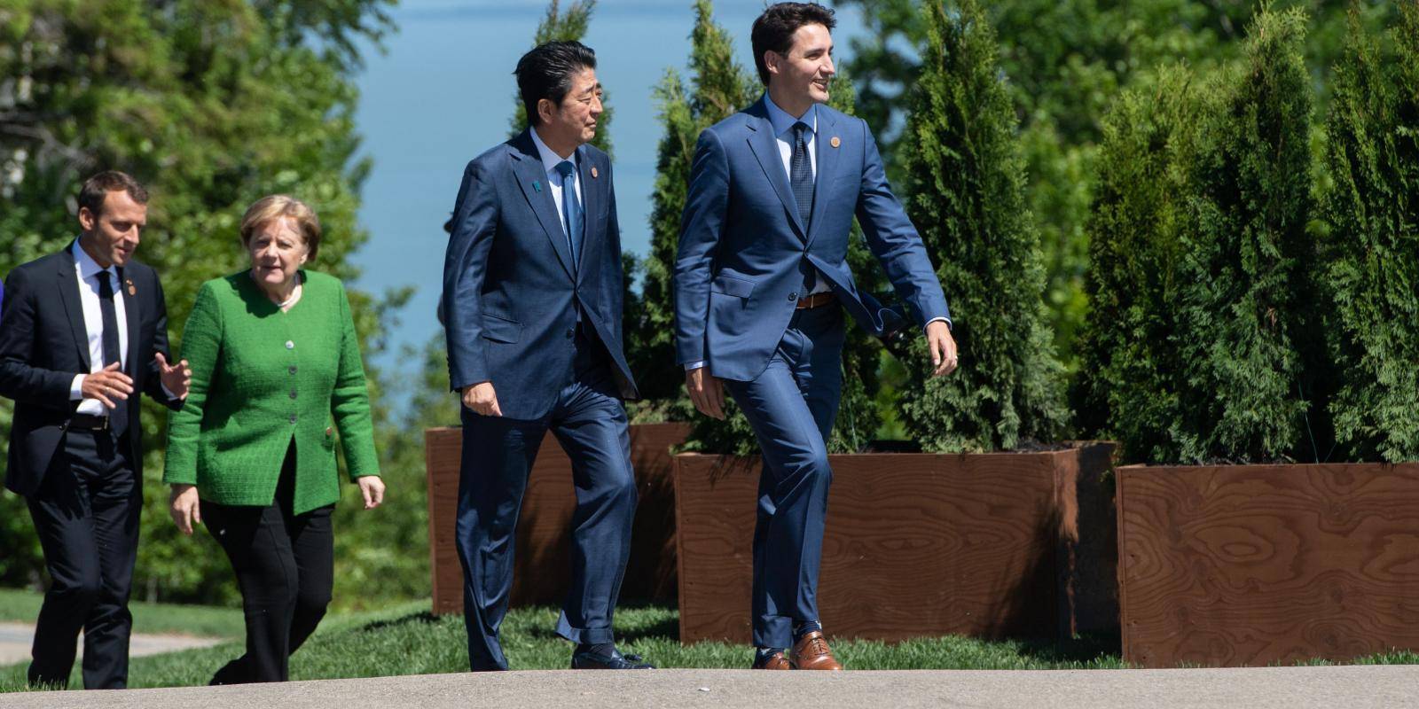 French President Emmanuel Macron, German Chancellor Angela Merkel, Japanese Prime Minister Shinzo Abe and Canadian Prime Minister Justin Trudeau during the G7 Summit in La Malbaie, Quebec, Canada on 8 June 2018.