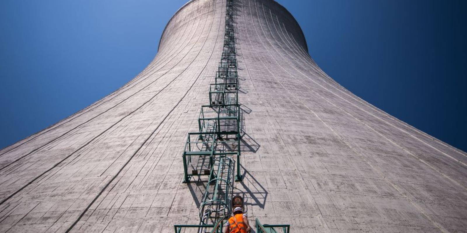 An employee climbs into the cooling tower of the third and fourth unit at Mochovce nuclear power plant in Slovakia on 2 July 2019. Photo: Getty Images