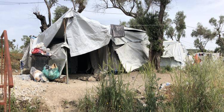 Photo of makeshift dwelling made from cloth in Moria refugee camp on Lesvos.