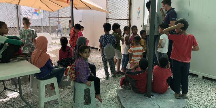 Photo of a group of children in Moria refugee camp on Lesvos. Photo by Anna Iasmi Vallianatou