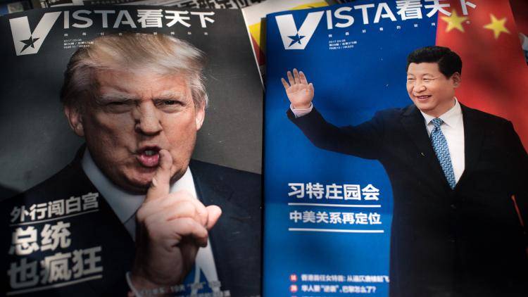 Magazines featuring US President Donald Trump and Chinese President Xi Jinping are displayed at a news stand in Beijing on 6 April 2017. Photo: Getty Images.