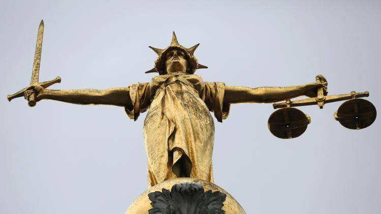 Scales of justice above the Old Bailey in London, England. Photo by Dan Kitwood/Getty Images.