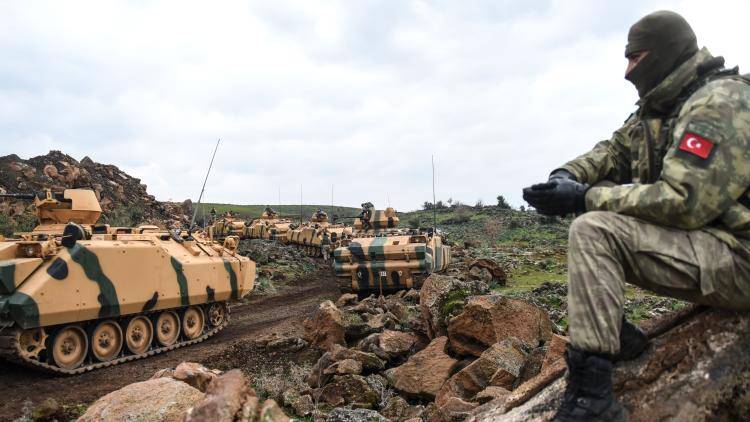 Turkish army troops gather near the Syrian border at Hassa, in Hatay province on January 21, 2018. Photo by BULENT KILIC/AFP via Getty Images.