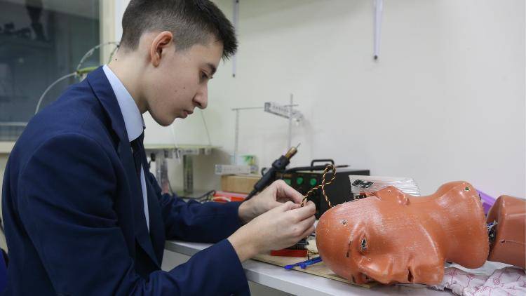 A student attends a lesson in robotics