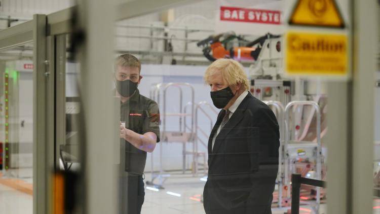 Boris Johnson standing in the Warton Aerodrome