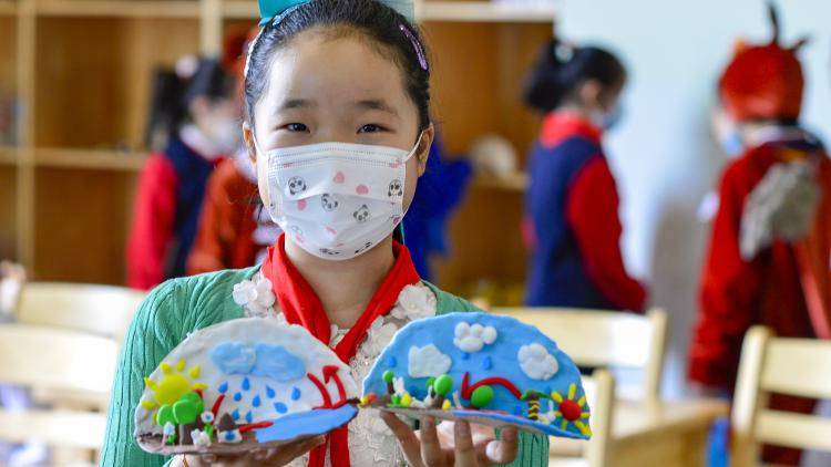 Student with her handmade water circulation models for World Water Day 2021 at the Inner Mongolia Museum of Natural History in Hohhot, part of the Inner Mongolia Autonomous Region of China. Photo by Wang Zheng/VCG via Getty Images.