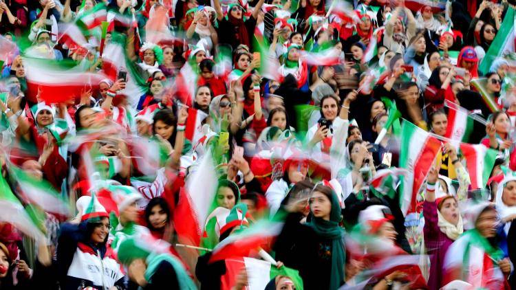 Iranian women during a football match between Iran and Cambodia in Tehran on 10 October 2019. Iran had barred women from attending football matches for over 40 years but women were allowed to attend for the first time in decades after FIFA threatened to suspend the country over its controversial male-only policy. Photo: Getty Images.