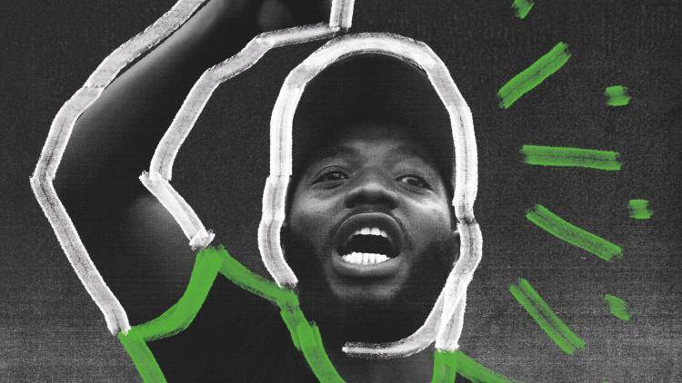 A Nigerian protester raising their arm