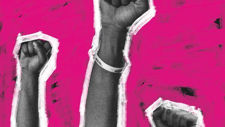 Three hands held in the air forming fists as a form of protest