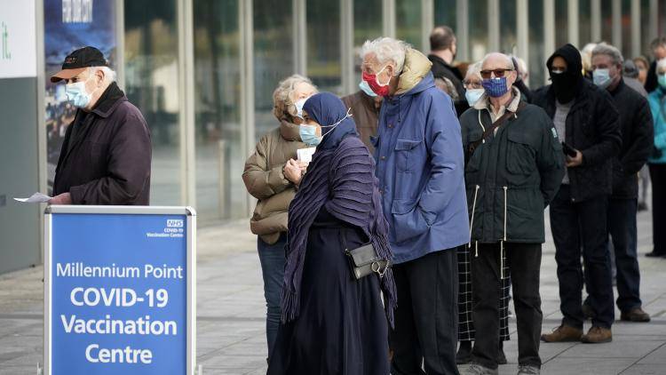 People queuing outside a Covid-19 vaccine centre in Birmingham