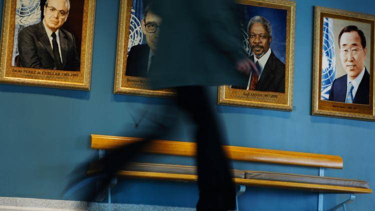 A woman walks along the United Nations hallway before a meeting with candidates competing for the position of UN secretary-general on 14 April 2016 in New York, US. At least eight candidates are running for the office – four men and four women. A woman selection would be the first for the UN and one of the top canadiates is former New Zealand Prime Minister Helen Clark. Photo: Eduardo Munoz Alvarez via Getty Images.