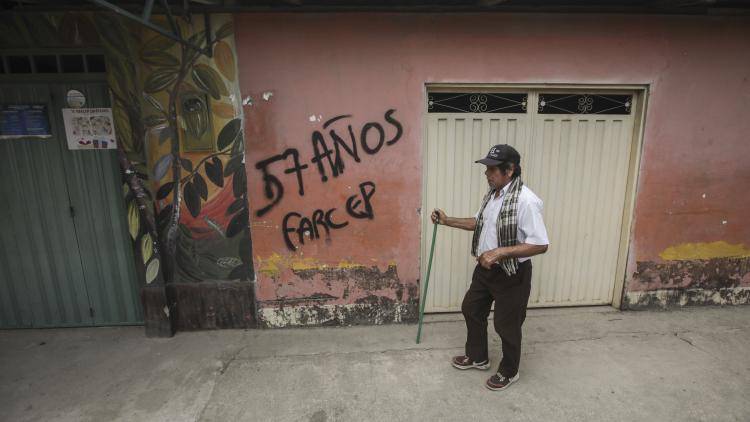 Threatening graffiti on a wall in Saravena, Colombia, is used by armed groups to intimidate voters in the run up to the presidential elections