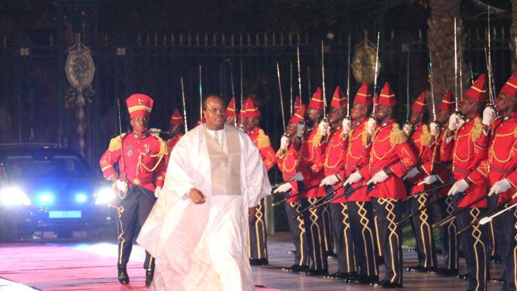 King of Swaziland Mswati III walks past the guard of honor on a state visit to Senegal on July 05, 2019