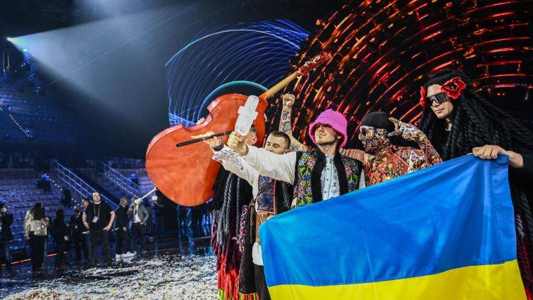 Winners of 2022 Eurovision, Ukraine's Kalush Orchestra, on stage with their trophy