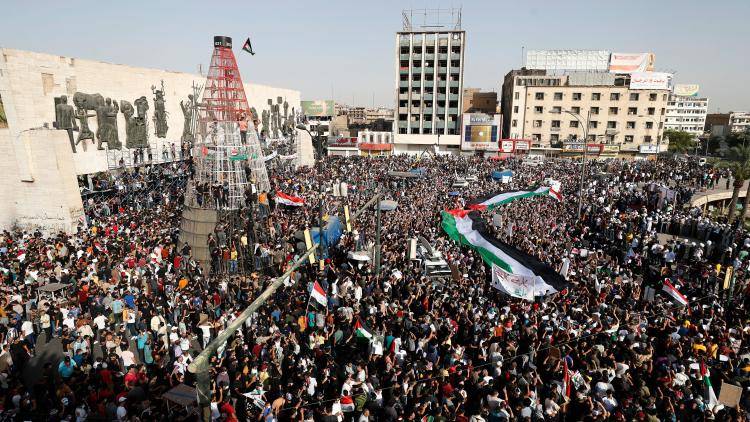 Iraqis gather in the capital Baghdad's Tahrir square for a solidarity march with the Palestinians, on 15 May, 2021