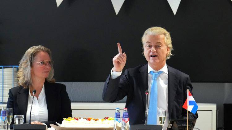 Geert Wilders leader of the Dutch Party for Freedom gives a speech sitting at a desk following his party's success in the 23 November 2023 general election in the Netherlands