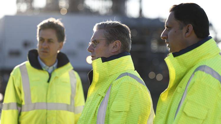 Shadow Secretary of State of Climate Change and Net Zero Ed Miliband, Labour leader, Sir Keir Starmer and Scottish Labour leader Anas Sarwar wearing high visibility clothing while touring St Fergus Gas Terminal on November 17, 2023 