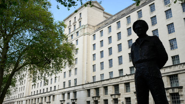 A silhouetted statue outside the UK Ministry of Defence