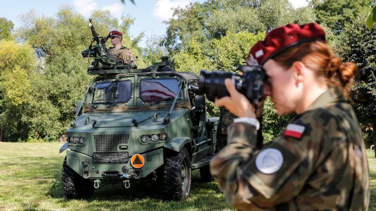 Servicemen stand in an armoured vehicle during the commencement ceremony of the EU Battle Group's duty in 6th Logistics Battalion in Krakow, Poland. 
