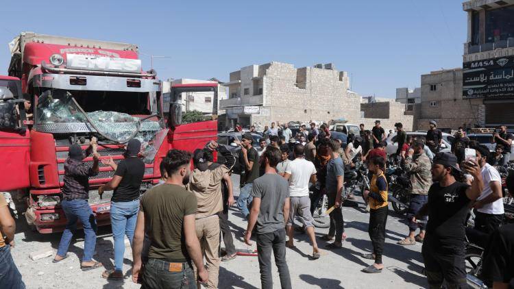 Protesters attack a Turkish truck during demonstrations against Turkey in al-Bab, in Aleppo on July 1, 2024