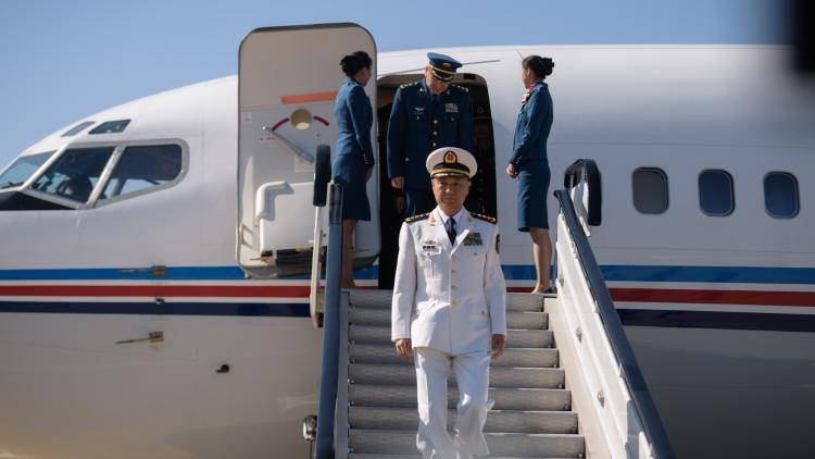 Miao Hua, China's director of the political affairs department of the Central Military Commission, disembarks his aircraft after arriving at Pyongyang International Airport.