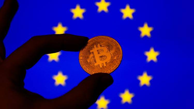 A Bitcoin image and an EU flag