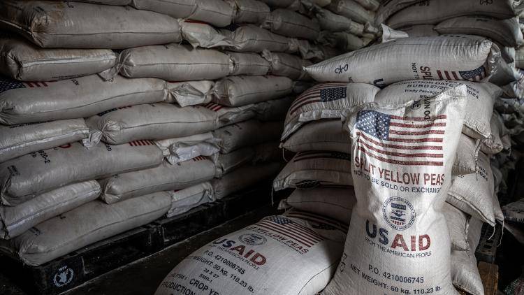 Sacks of the final batches of yellow peas delivered by the now-dismantled United States Agency for International Development (USAID) at the Cishemere Transit Center near Buganda, Uganda, on May 6, 2025. 