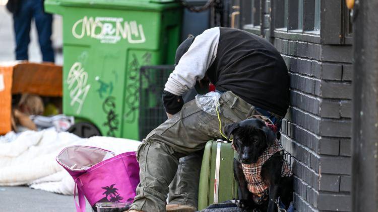 a homeless man and his dog in San Francisco. 