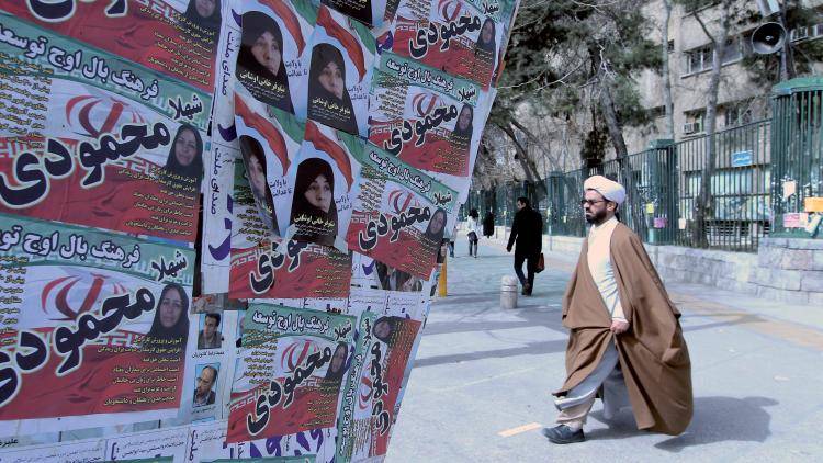 Campaign posters on display in Tehran on the eve of a parliamentary election. Photo: Atta Kenare/AFP/Getty Images
