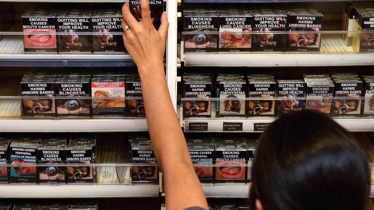 The unappealing cigarette packaging on display in a Sydney store. Photo: William West/Getty Images