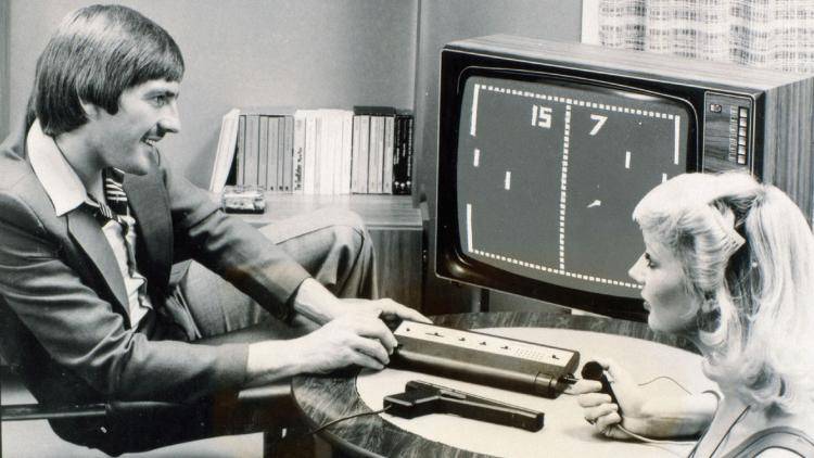 Liverpool footballer Steve Heighway tries his hand at Pong in the 1970s. Photo: Science Museum/Science&Society Picture Library